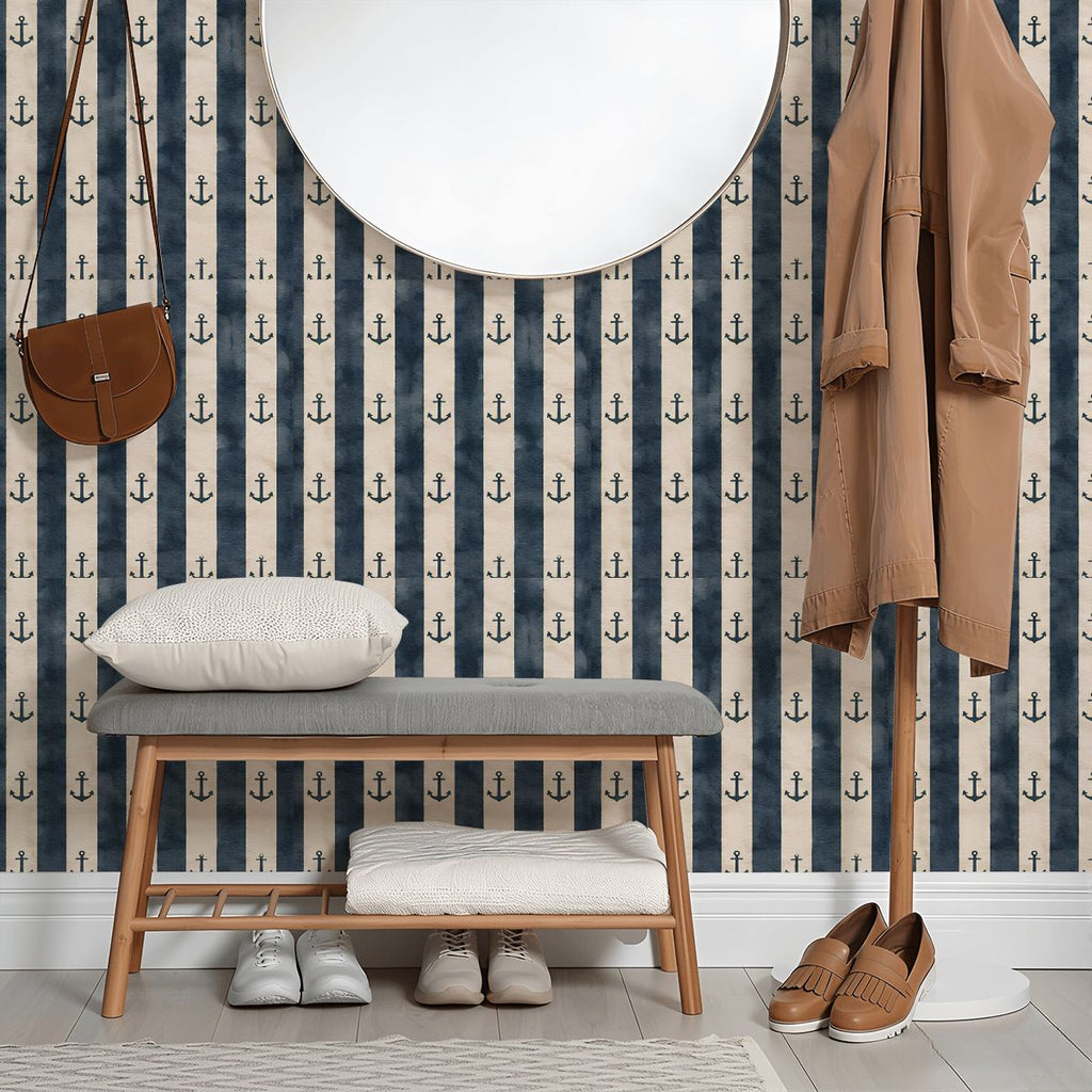 Nautical navy blue and white striped wallpaper with anchor pattern in a modern entryway.
