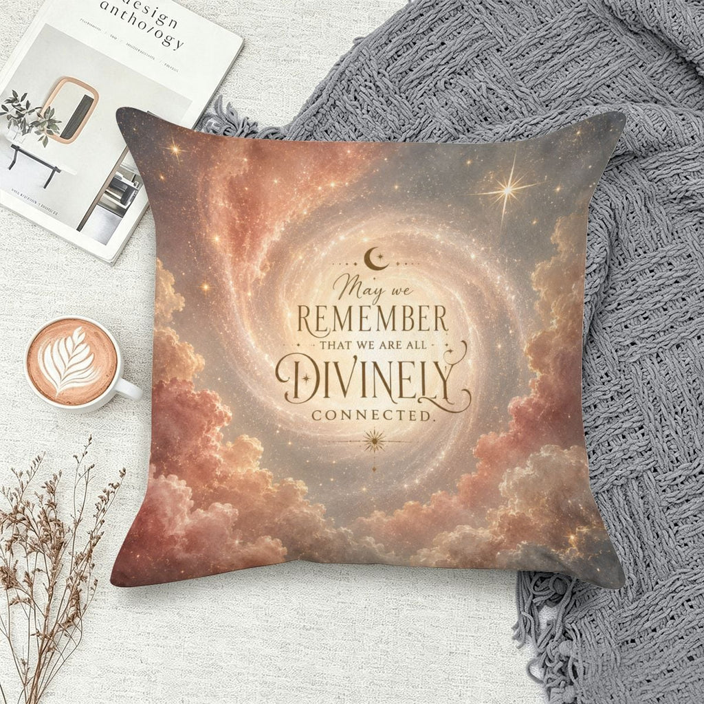 Decorative throw pillow with cosmic clouds and spiritual text 'May we remember that we are all divinely connected'