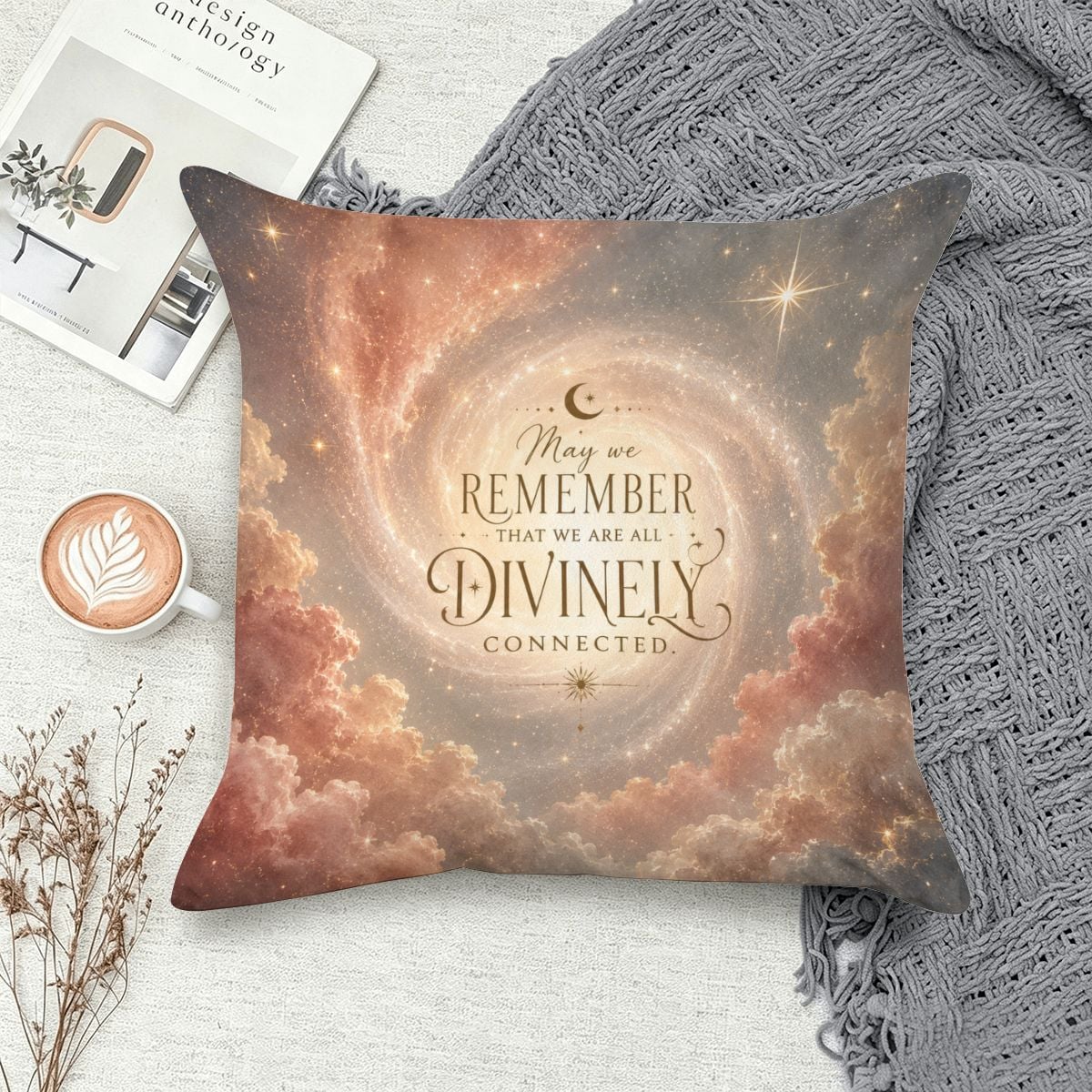 Decorative throw pillow with cosmic clouds and spiritual text 'May we remember that we are all divinely connected'