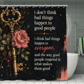 Black shower curtain with golden vintage key, pink roses, and inspirational quote.