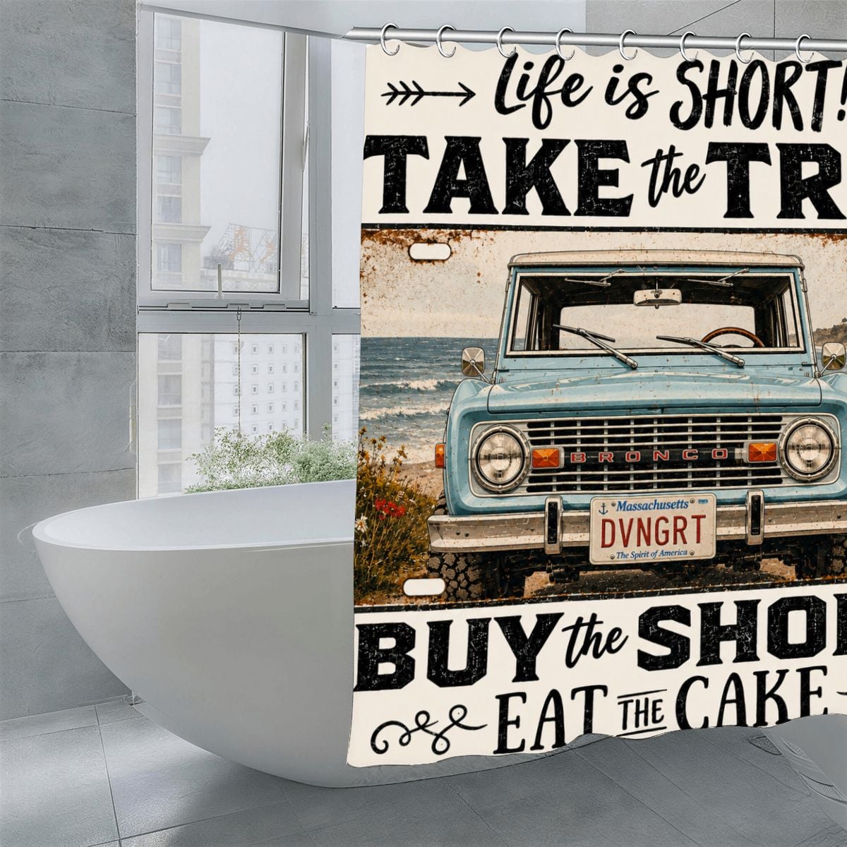 Vintage blue Bronco truck shower curtain with adventure quote in a modern bathroom.