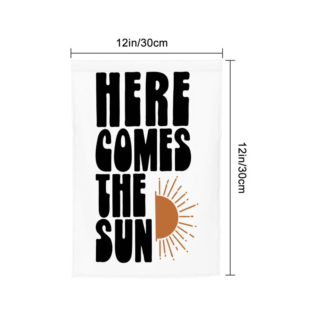 Colorful "Here Comes The Sun" garden flag by Sandy Beach featuring bright sun and floral design, ideal for outdoor garden decor.