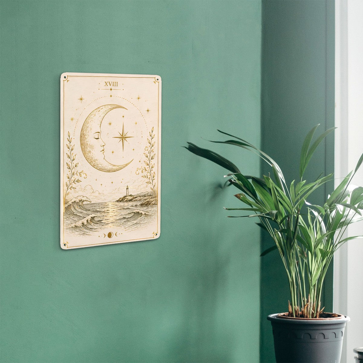 Celestial moon and ocean landscape wall art poster on a green wall next to a potted plant.