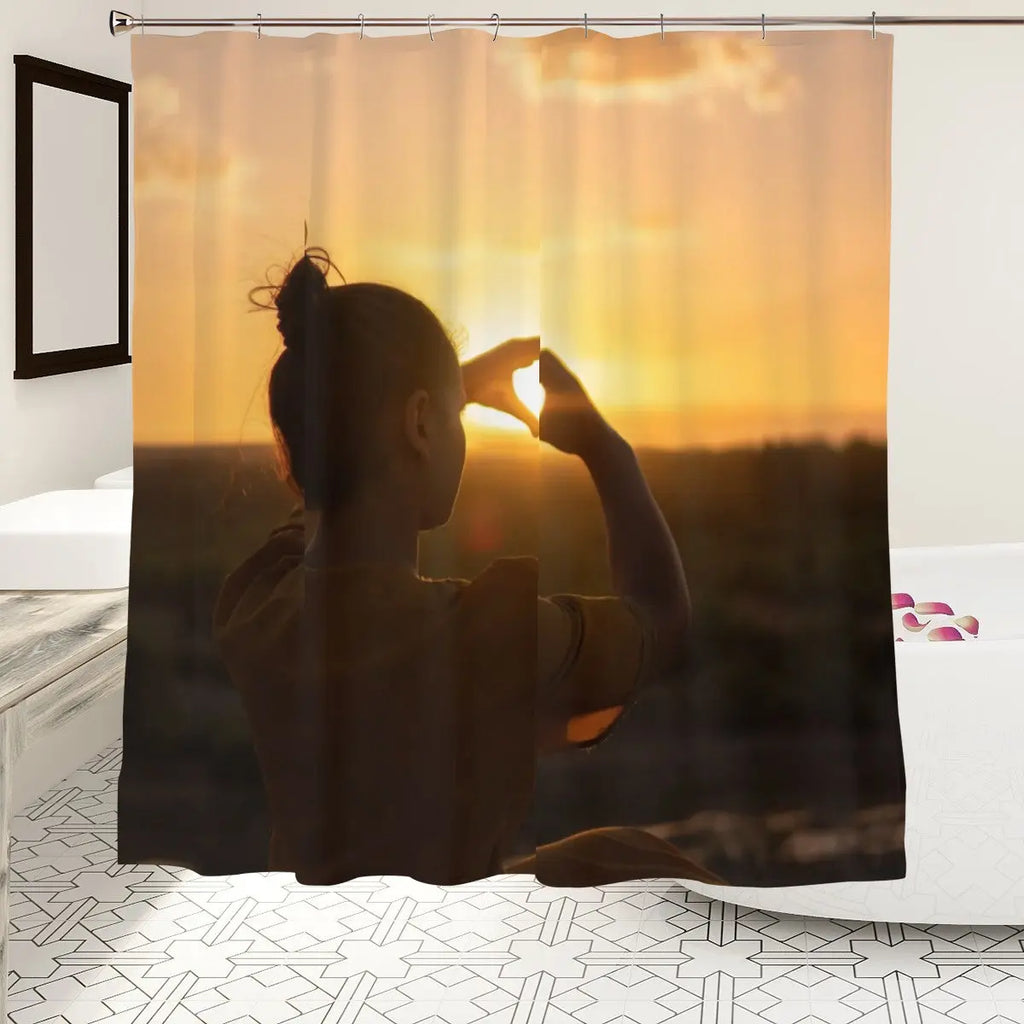 Silhouette heart sunset shower curtain featuring warm colors and romantic design, perfect for bathroom decor by Sandy Beach.