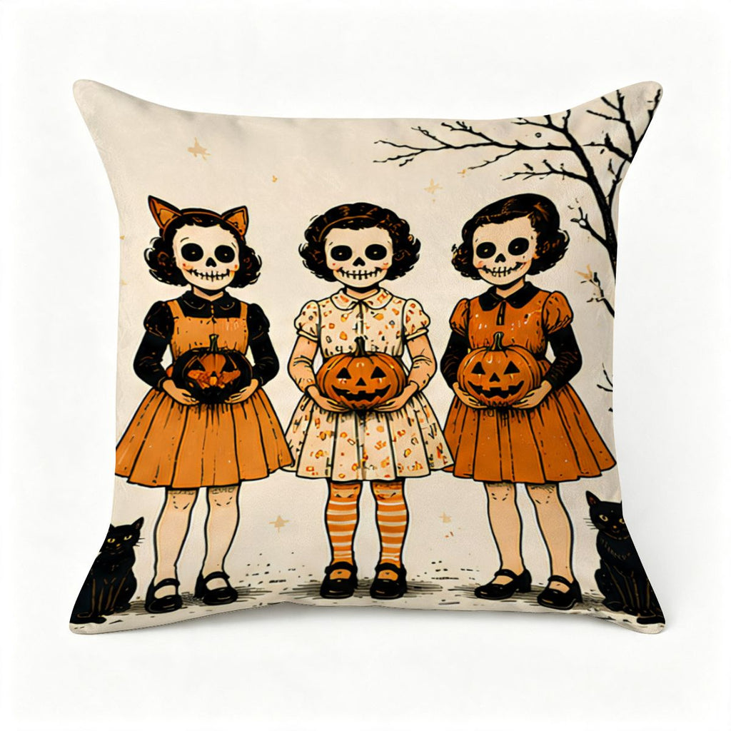 Decorative throw pillow featuring three girls in skeleton face paint holding jack-o'-lanterns.
