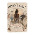 Divine Grit inspirational metal sign featuring a woman by the ocean at sunset.
