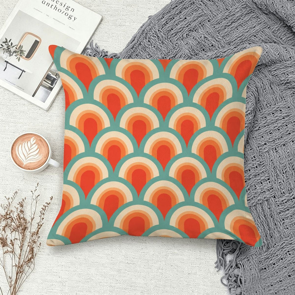 Retro 70s style throw pillow with orange, teal, and cream scalloped wave pattern.