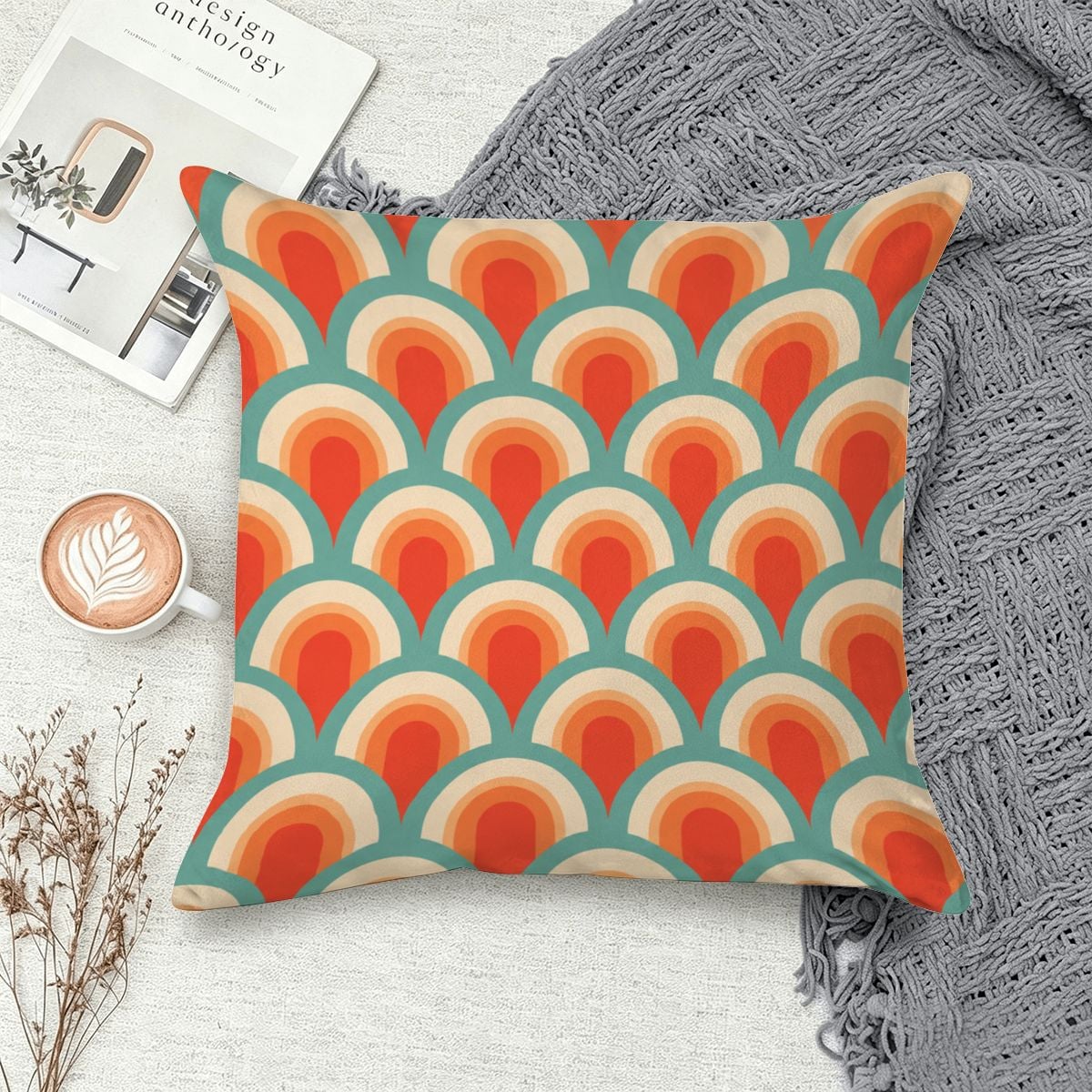 Retro 70s style throw pillow with orange, teal, and cream scalloped wave pattern.