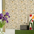 Botanical pattern wallpaper featuring vintage illustrations of herbs, bees, and wildflowers.