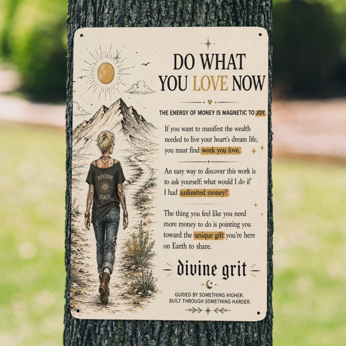 A decorative metal sign on a tree featuring a woman walking toward mountains with motivational text.
