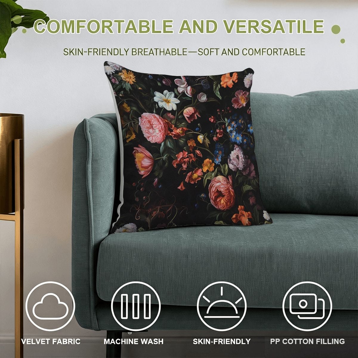 Floral print velvet throw pillow with colorful blossoms on a dark background on a teal sofa.