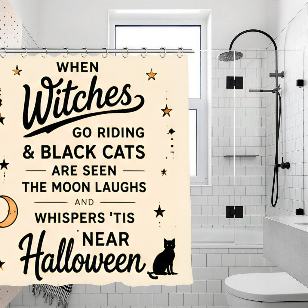 Halloween shower curtain with witch and black cat quote in a modern white bathroom.