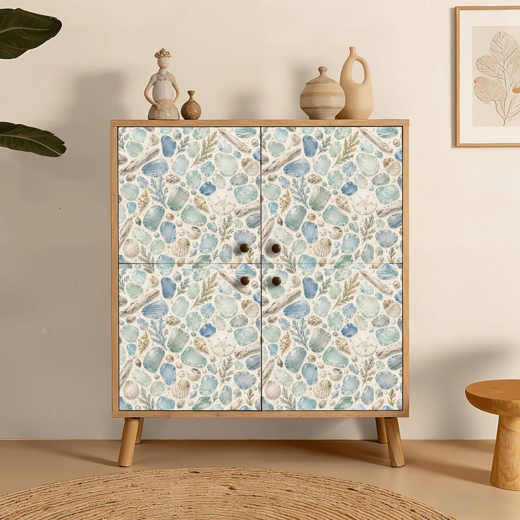 Wooden cabinet featuring a coastal seashell and ocean themed pattern.