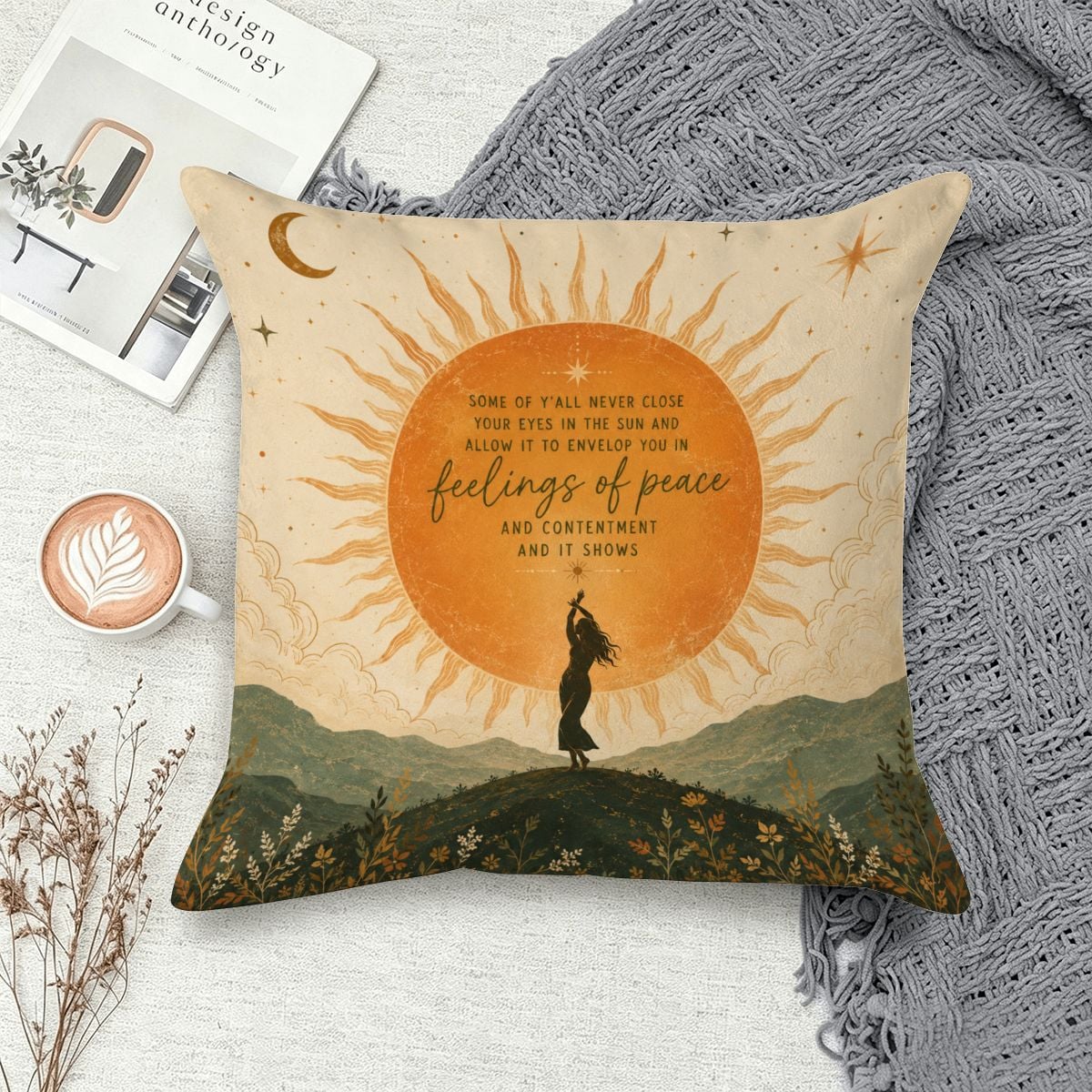 Decorative throw pillow featuring a sun, moon, and silhouette of a woman in a peaceful landscape.