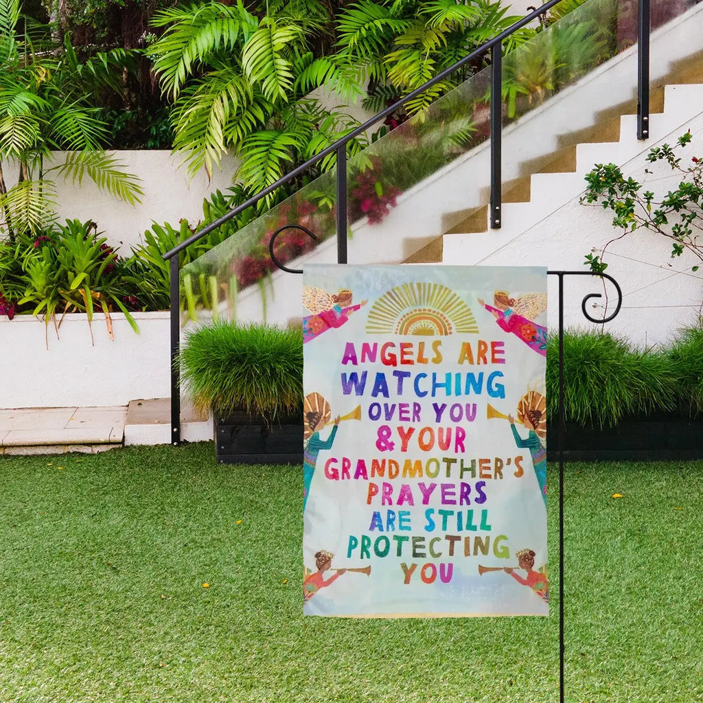 Decorative garden flag featuring angels watching over, with the Sandy Beach brand logo, ideal for outdoor garden decor.