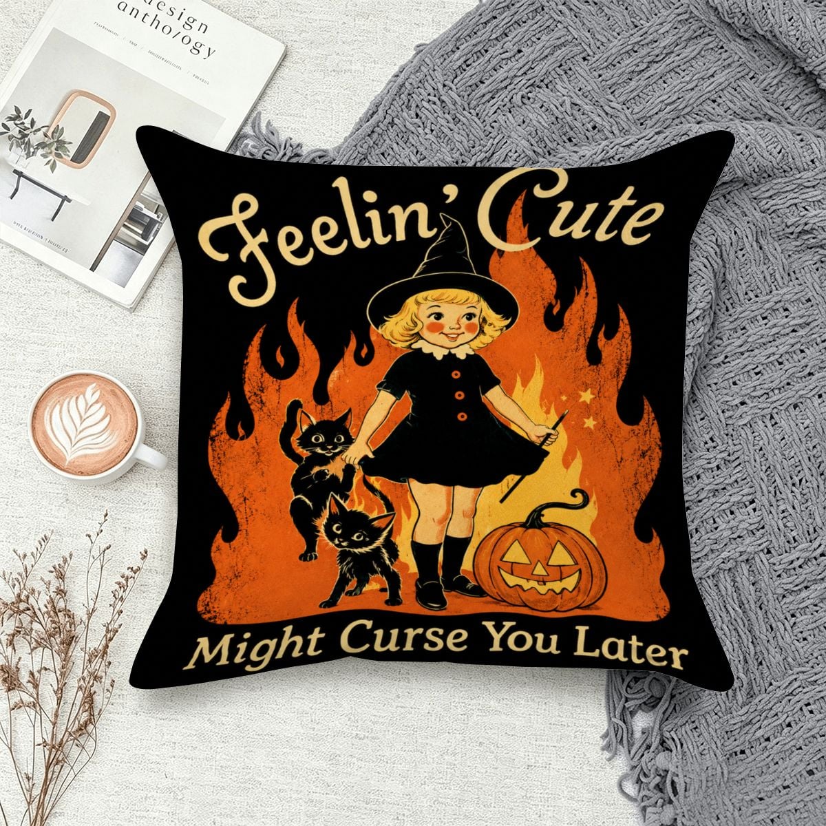 Halloween throw pillow featuring a cute witch, black cats, and a pumpkin with spooky text.