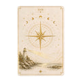 Tarot card style art featuring a lighthouse, compass rose, and celestial moon phases in gold.