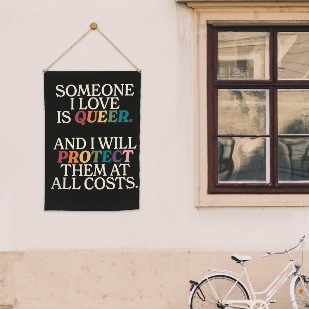 Colorful garden flag with "Someone I Love Is Queer" message, decorative garden decor by Sandy Beach, suitable for outdoor display.