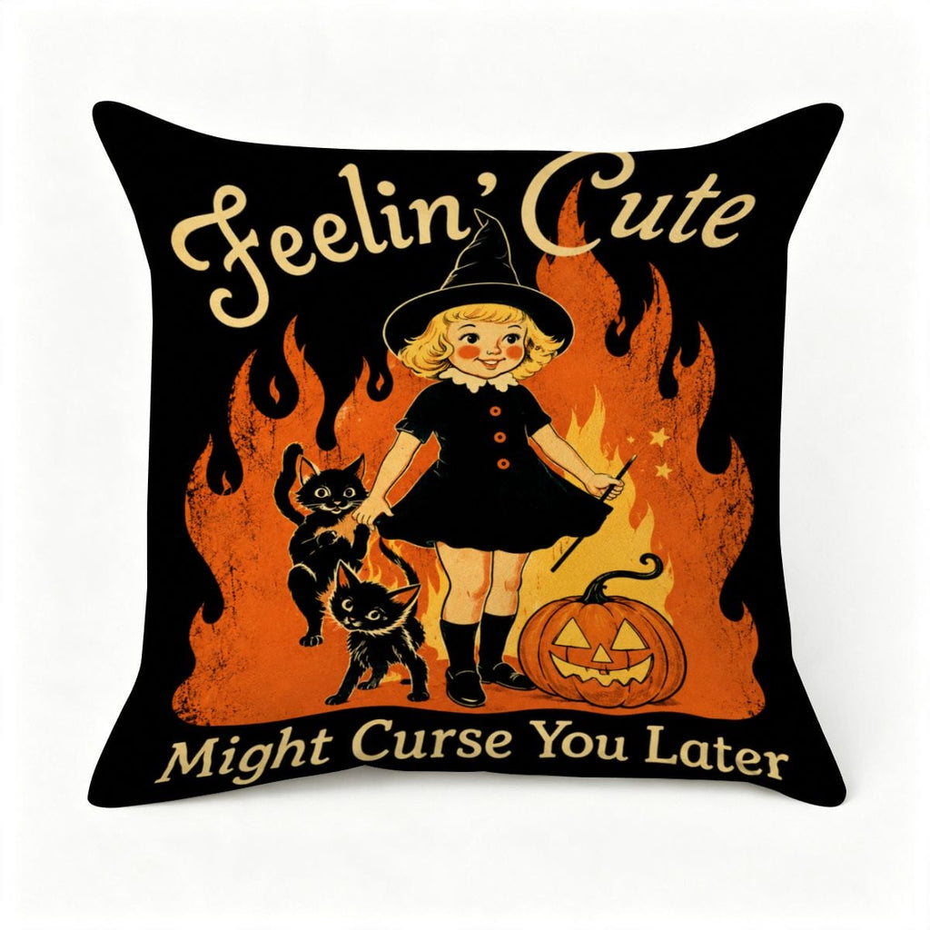 Halloween throw pillow featuring a cute witch, black cats, and a pumpkin on a black background.