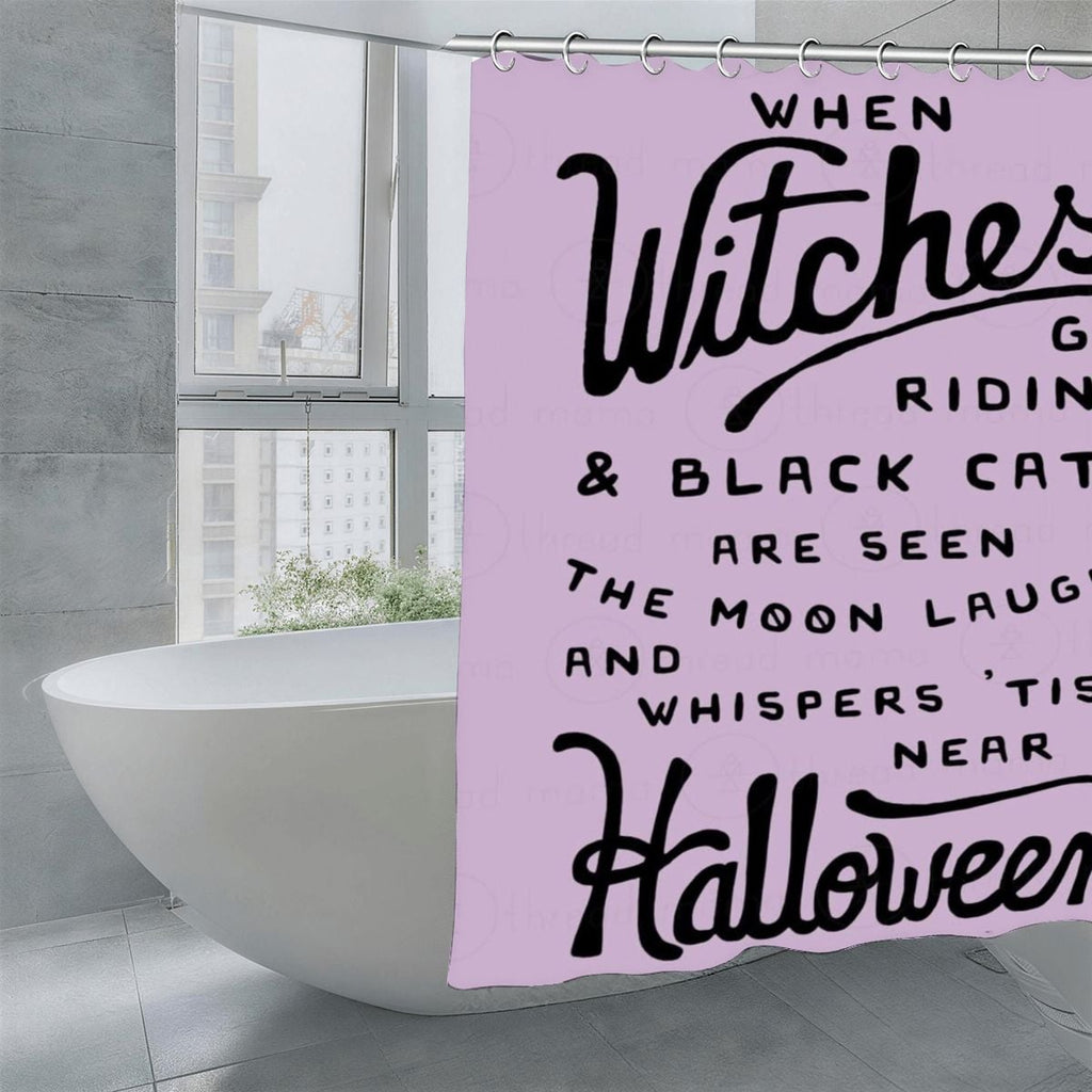 Lavender Halloween shower curtain with black witch and black cat typography.