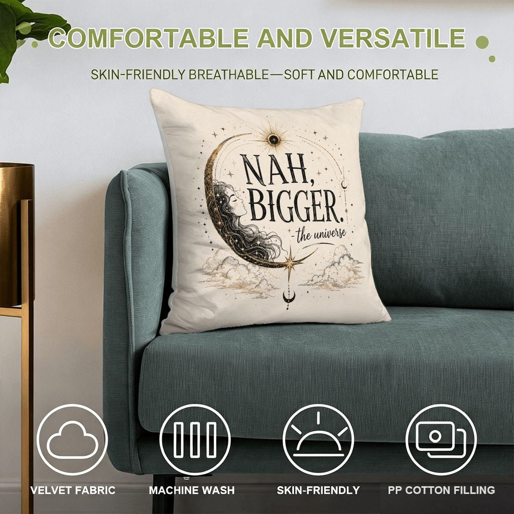 Decorative throw pillow with celestial moon design and 'Nah, Bigger. The Universe' text on a sofa.