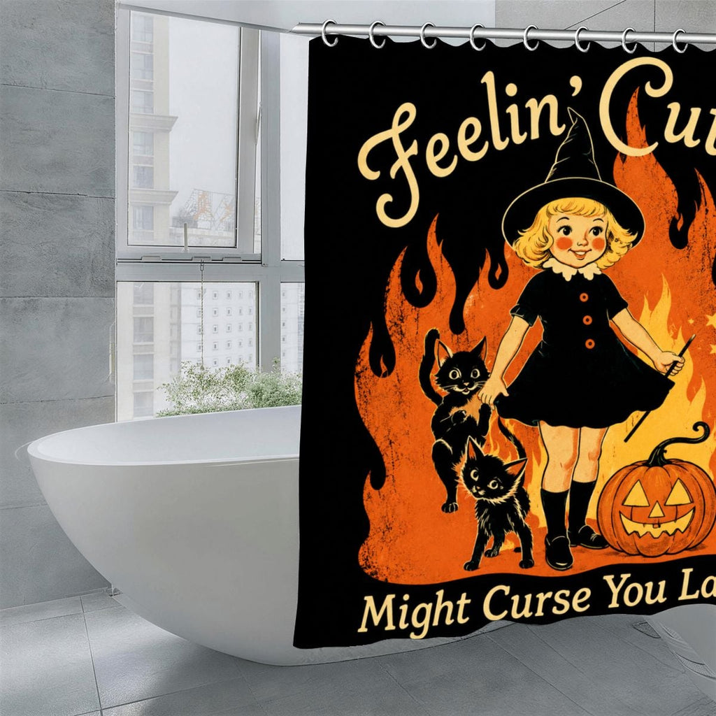 Halloween shower curtain featuring a witch girl, black cats, and a pumpkin on a black background