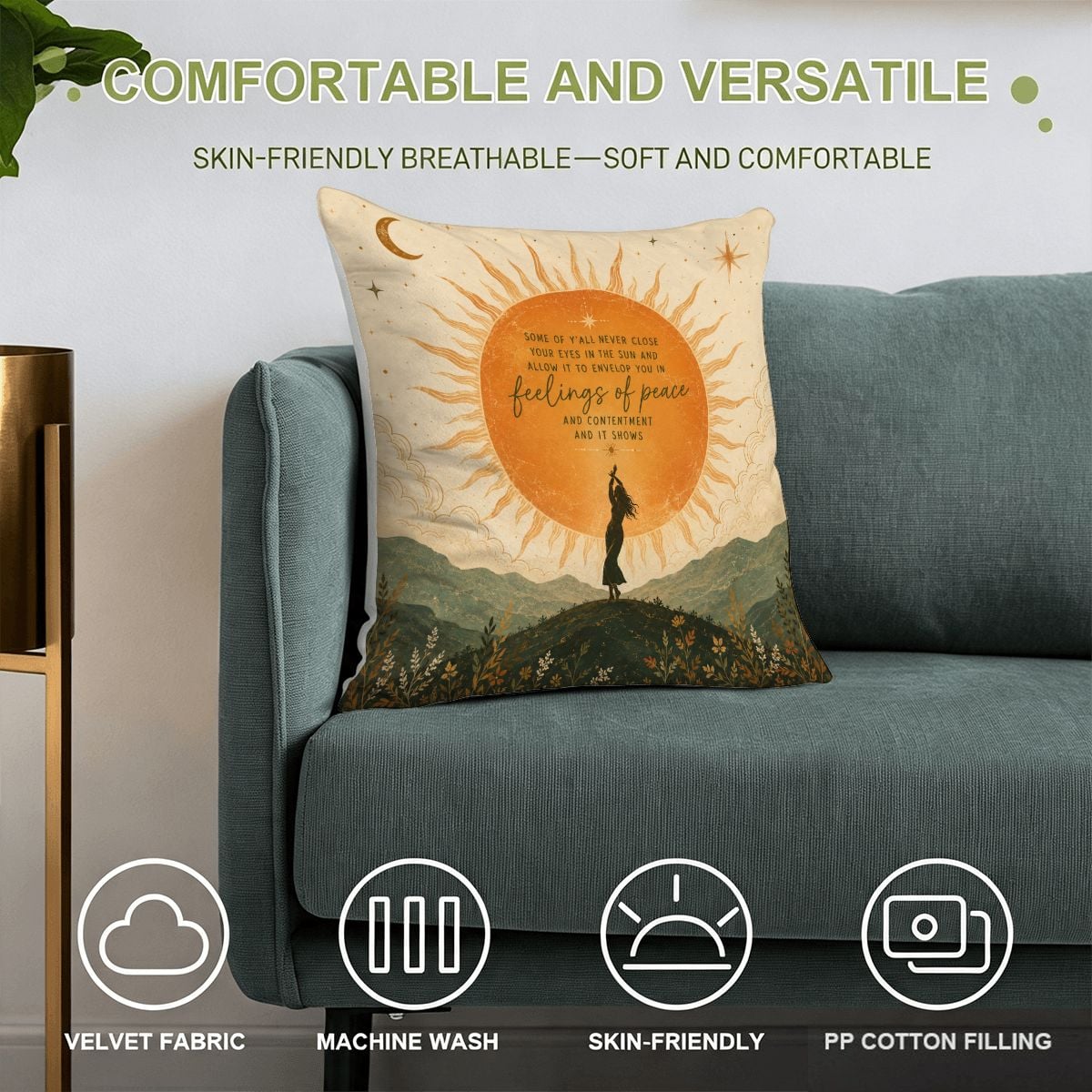 Decorative velvet throw pillow with celestial landscape and inspirational quote on a blue sofa.