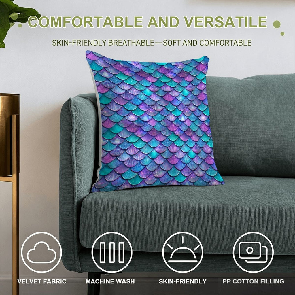 Colorful mermaid scale pattern velvet throw pillow on a gray sofa.