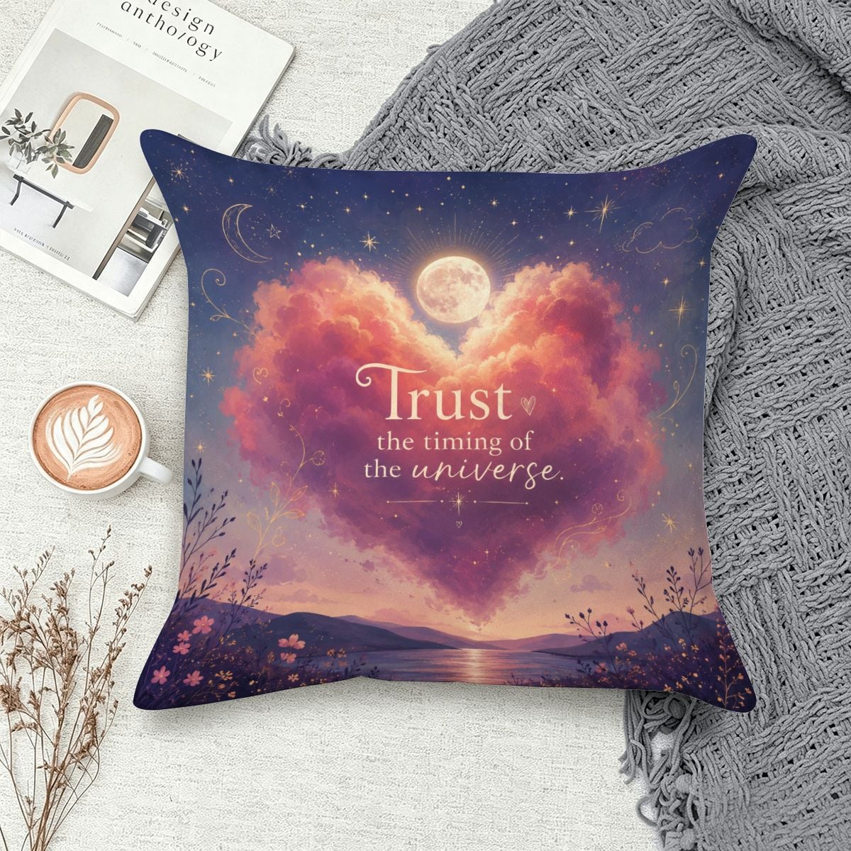 Decorative throw pillow with mystical heart clouds, moon, and 'Trust the timing of the universe' text.
