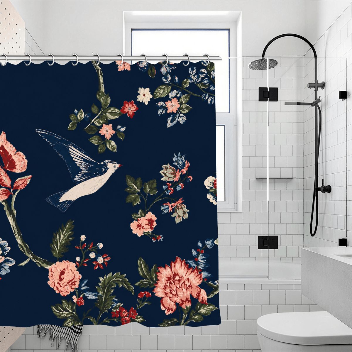 Navy blue floral shower curtain with vintage bird and pink flower patterns in a white bathroom.