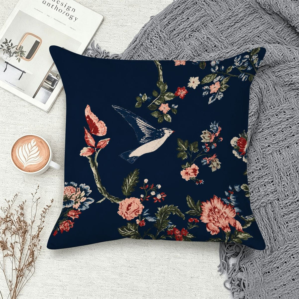 Navy blue decorative throw pillow featuring a vintage bird and floral pattern.