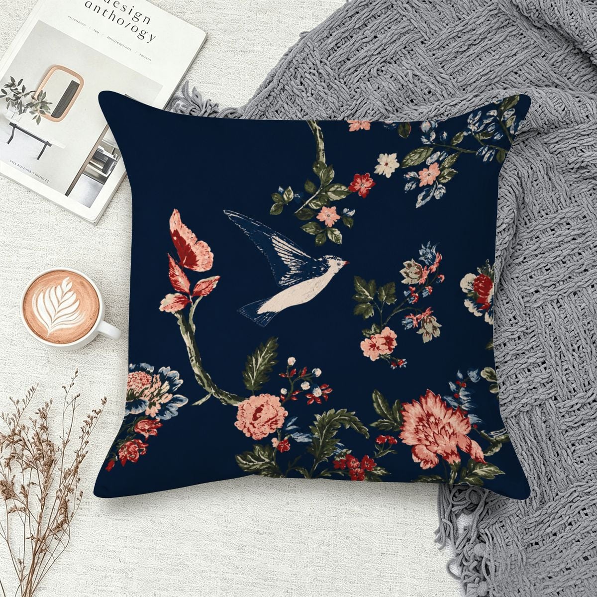 Navy blue decorative throw pillow featuring a vintage bird and floral pattern.