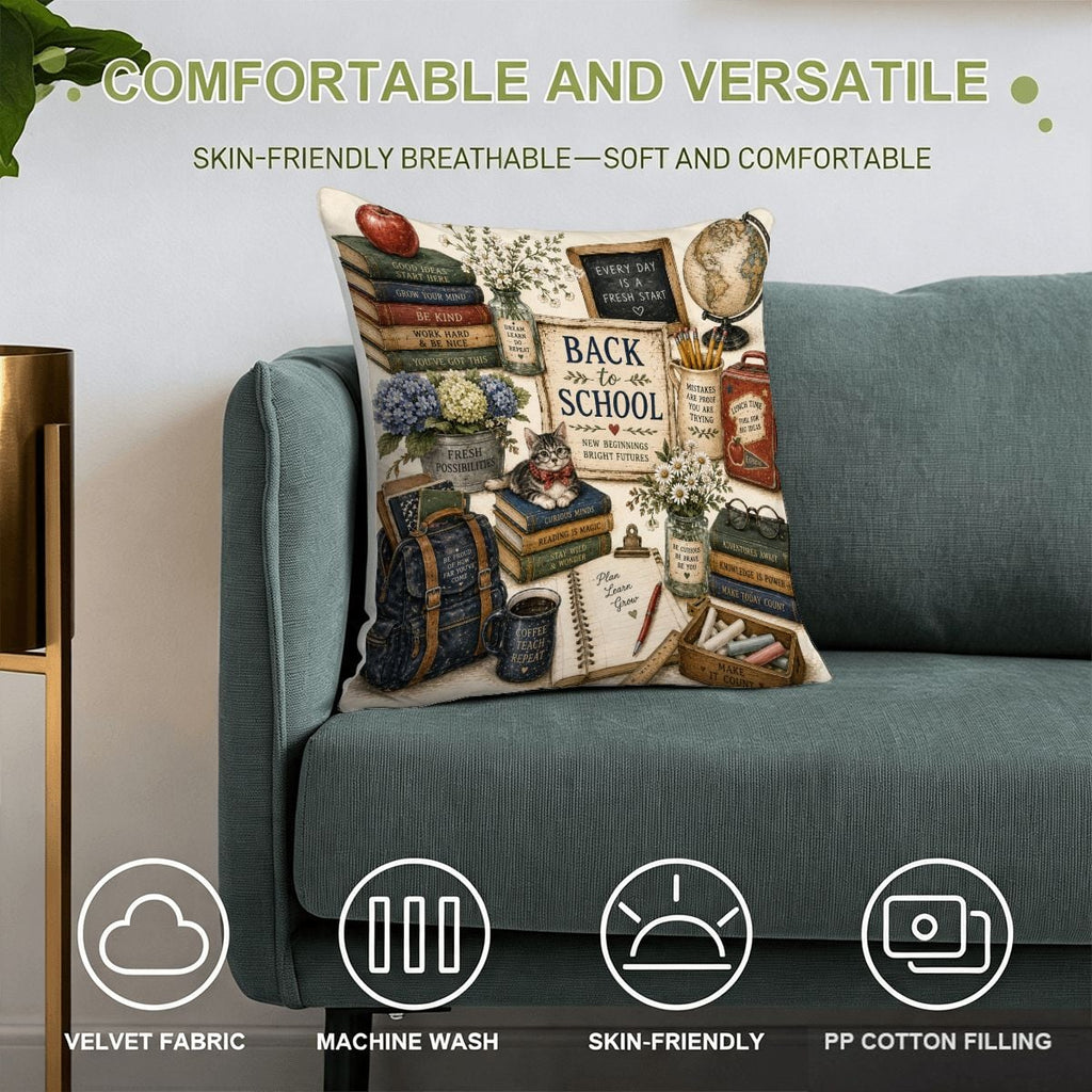 Back to school themed decorative throw pillow with books, globe, and school supplies on a blue sofa