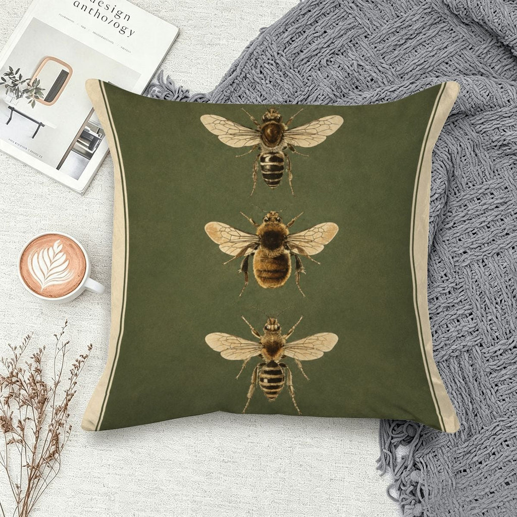 Green decorative throw pillow featuring three vintage-style honey bee illustrations.