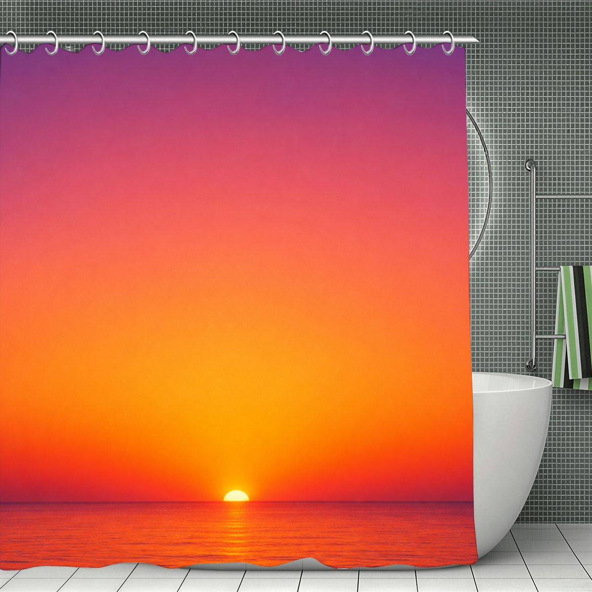 Sunset over the ocean with vibrant orange and pink sky shower curtain in a modern bathroom.