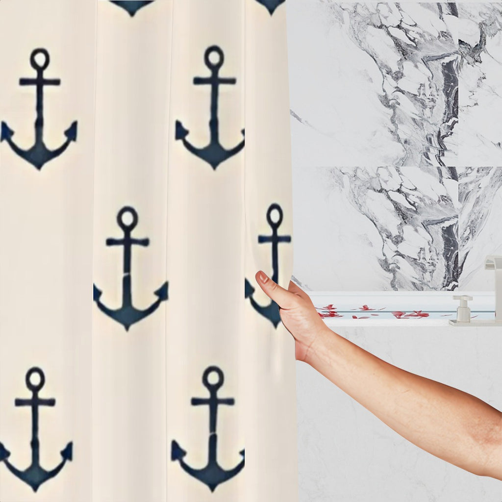 White shower curtain with navy blue anchor pattern in a marble bathroom setting.