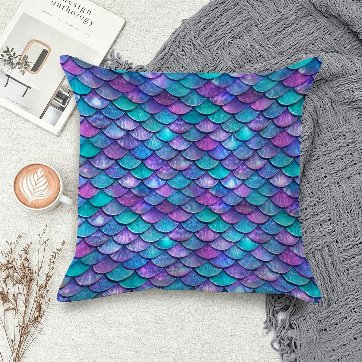 Decorative throw pillow with iridescent purple and teal mermaid scale pattern.