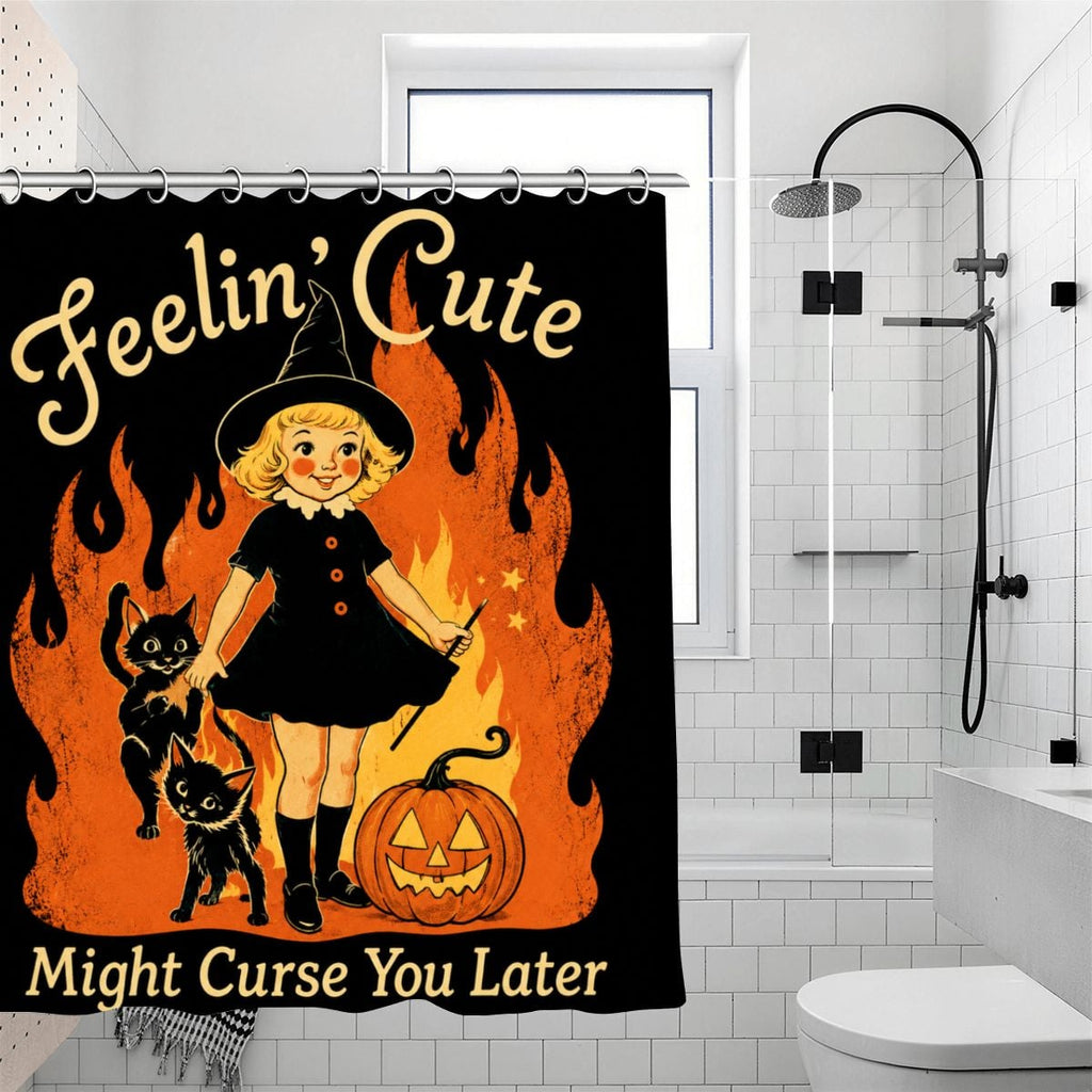 Halloween shower curtain featuring a cute witch, black cats, and a pumpkin with flames.