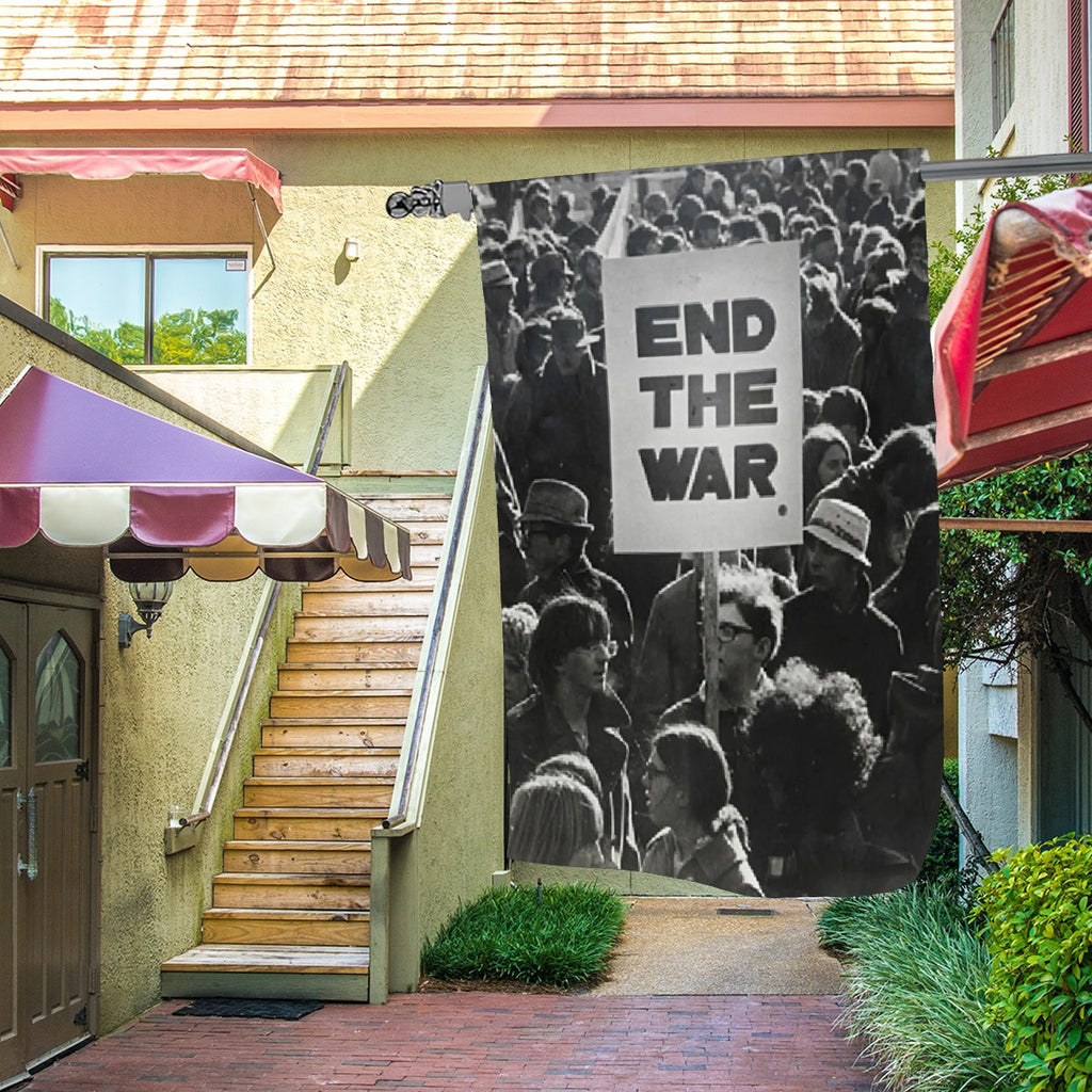 Garden decor garden flag featuring an "End The War" protest design by Sandy Beach, suitable for outdoor display.
