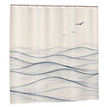 Sandy Beach bathroom decor shower curtain with ocean wave pattern hanging in a modern bathroom setting