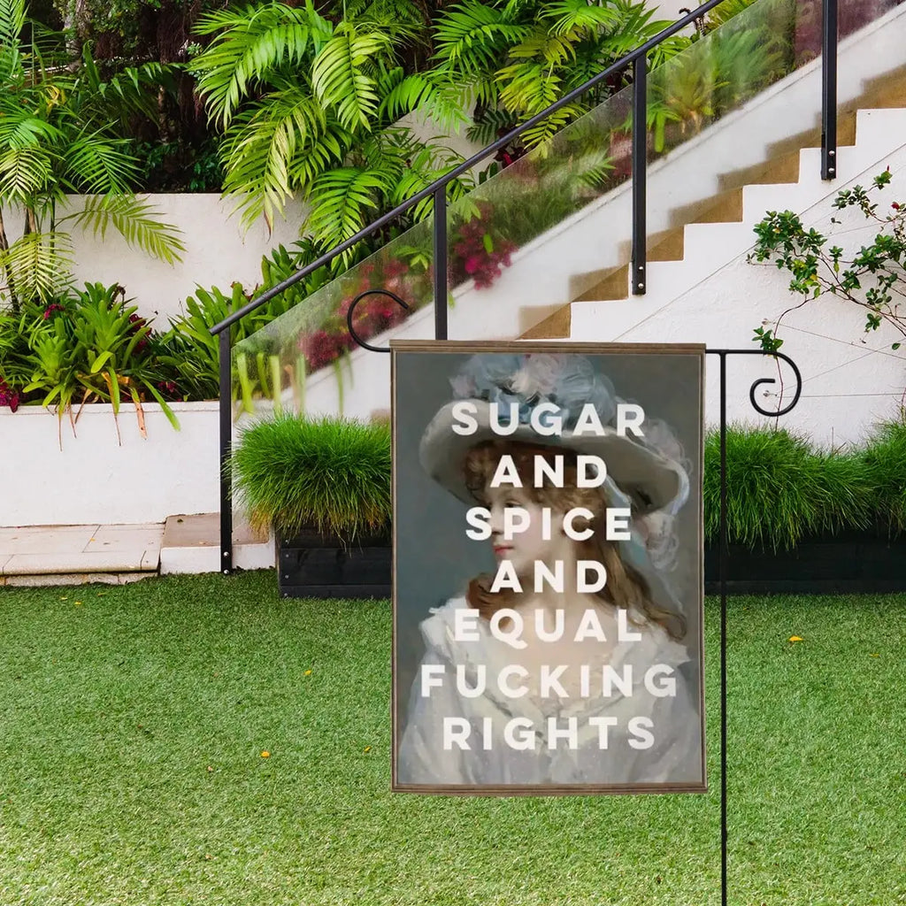 Colorful garden flag with "Sugar and Spice and Equal F*$king Rights" text, featuring vibrant floral and decorative elements, by Sandy Beach.