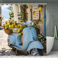 Light blue vintage Vespa scooter with a basket of fresh lemons in a sunny Italian coastal village.