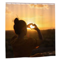 Silhouette heart sunset bathroom shower curtain with warm sunset colors and romantic design by Sandy Beach.