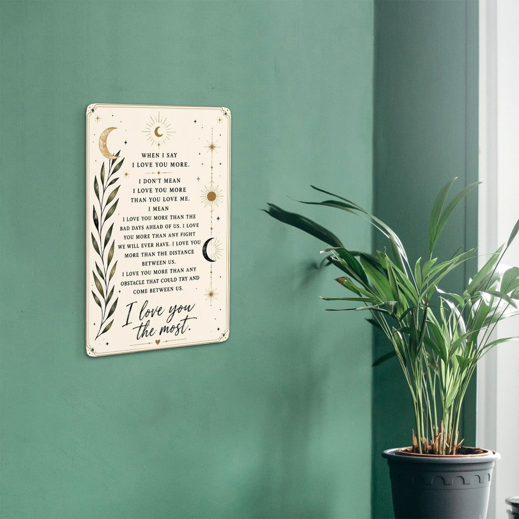 Inspirational quote wall art sign with celestial moon and botanical leaf design on green wall.