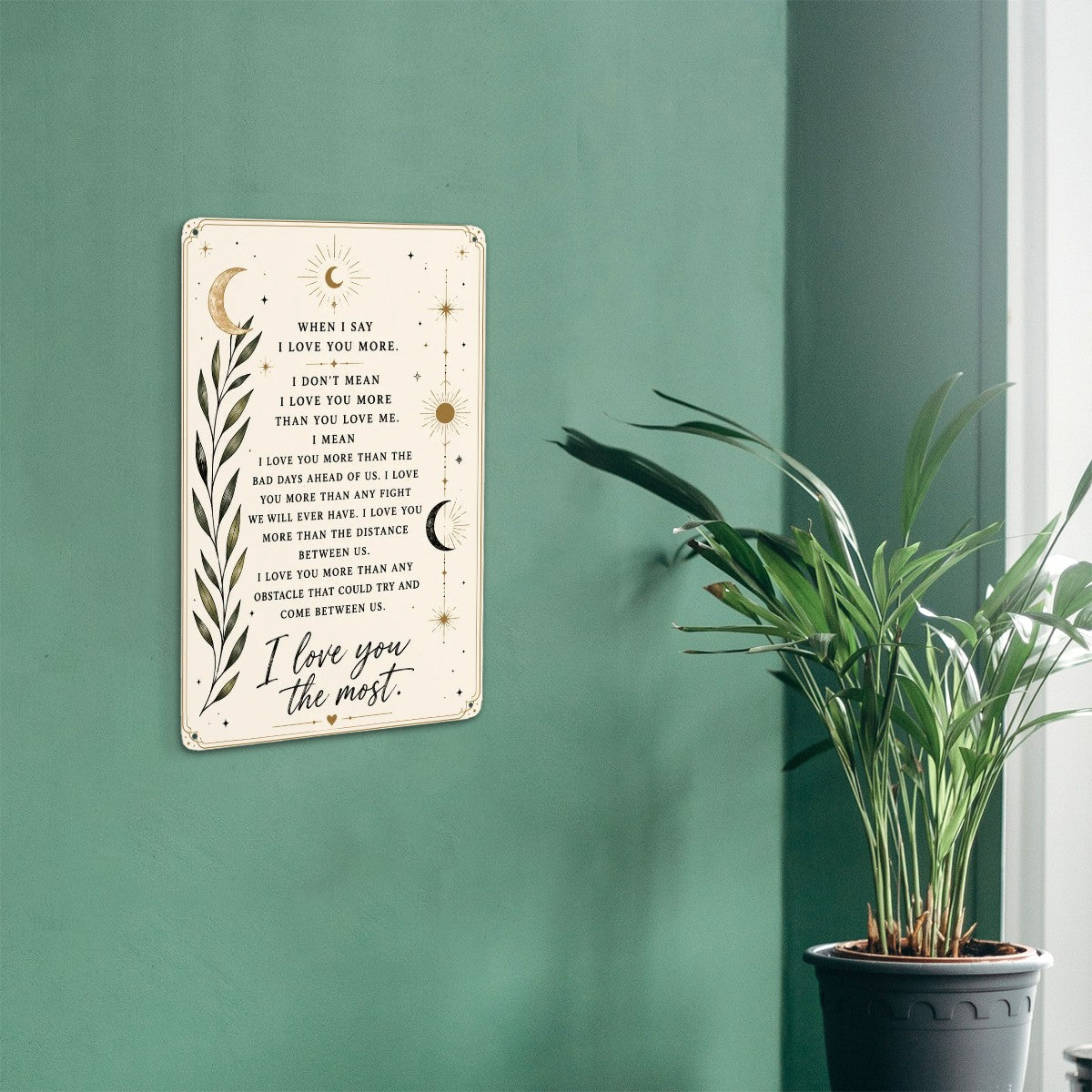 Inspirational quote wall art sign with celestial moon and botanical leaf design on green wall.