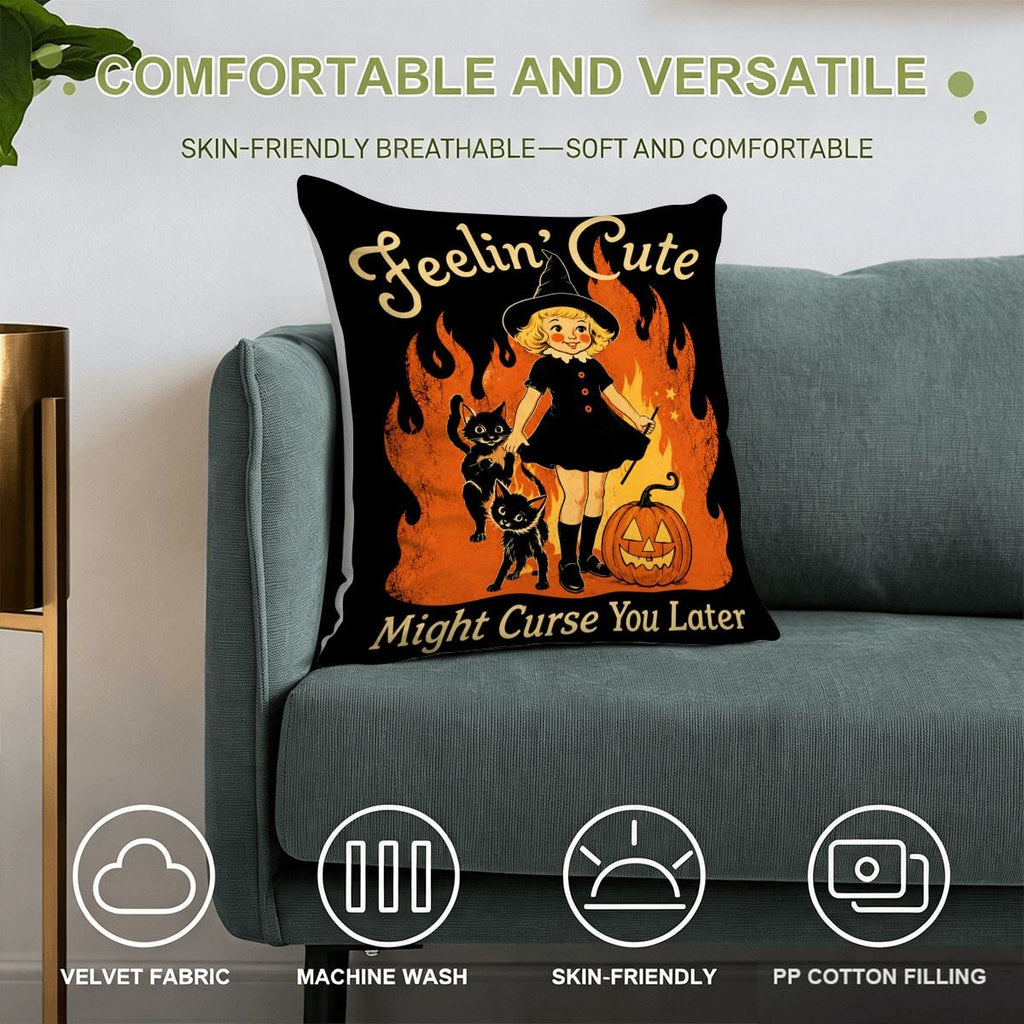Halloween witch throw pillow with cute girl and black cats on a teal sofa.