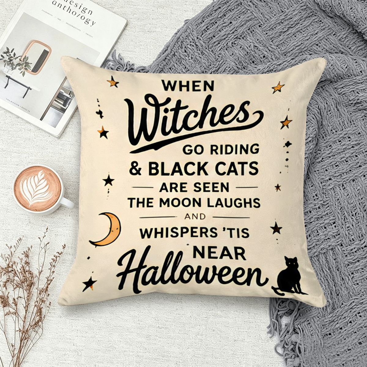 Cream Halloween throw pillow with black witch calligraphy and black cat illustration.