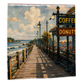 Artistic shower curtain featuring a boardwalk cafe with coffee and donuts signs by the ocean.