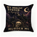 Gothic throw pillow featuring crows, a skull, and moon with text 'My immune system is trying to murder me'