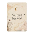 Boho celestial wall art sign with moon, stars, and text 'You can't buy aura'